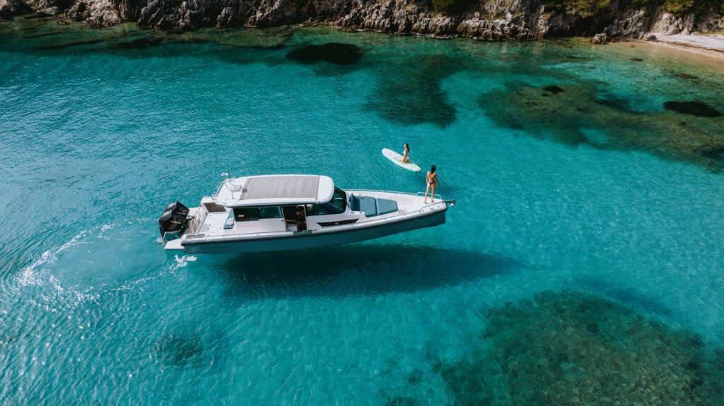 Axopar 37 XC Cabin cruising off the coast of Syvota under clear skies