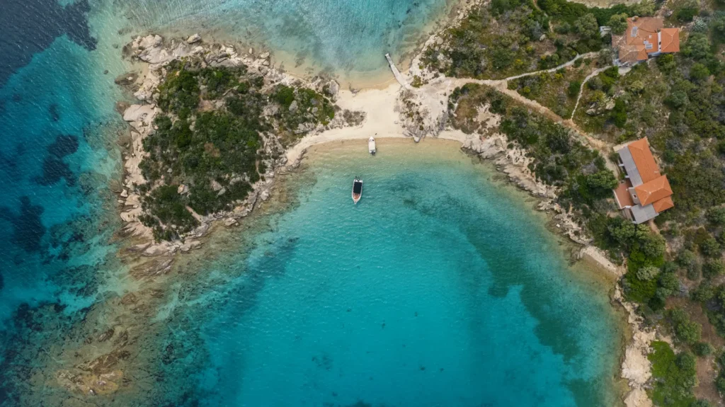 Aerial view of Peristeri Island in the Diaporos archipelago, Vourvourou, Sithonia, Halkidiki — a stop on the Premium 5-hour private cruise with Explore Boat Trips