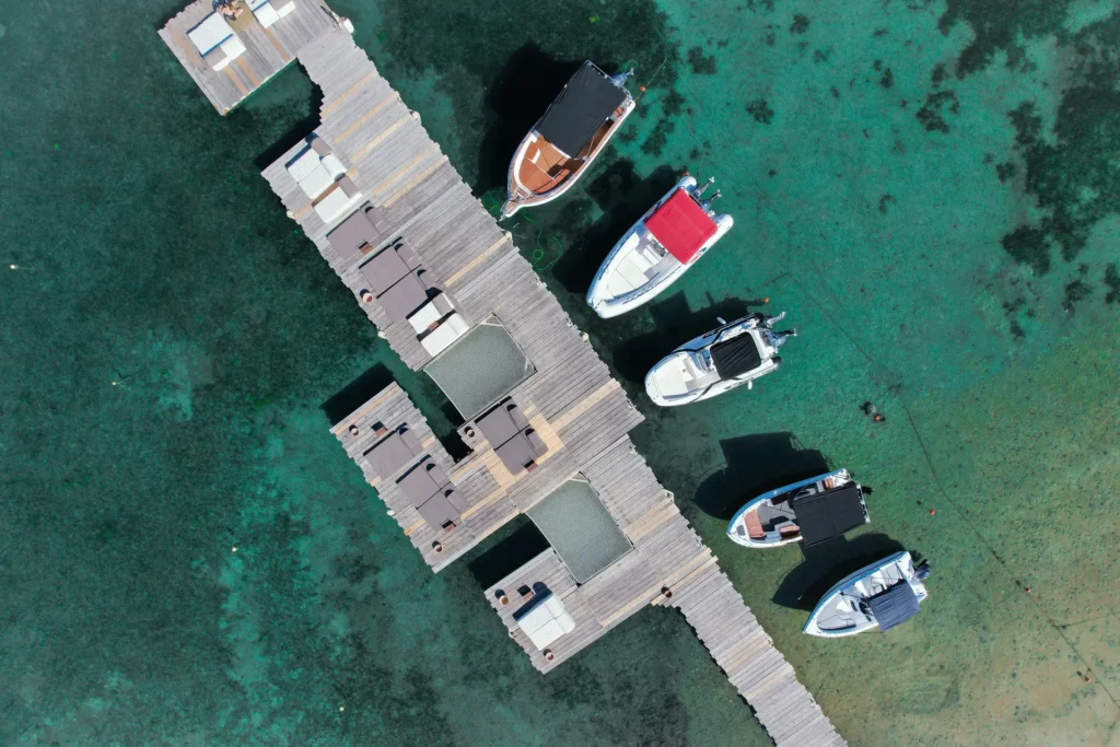 Family boarding a motorboat directly from a beachfront resort