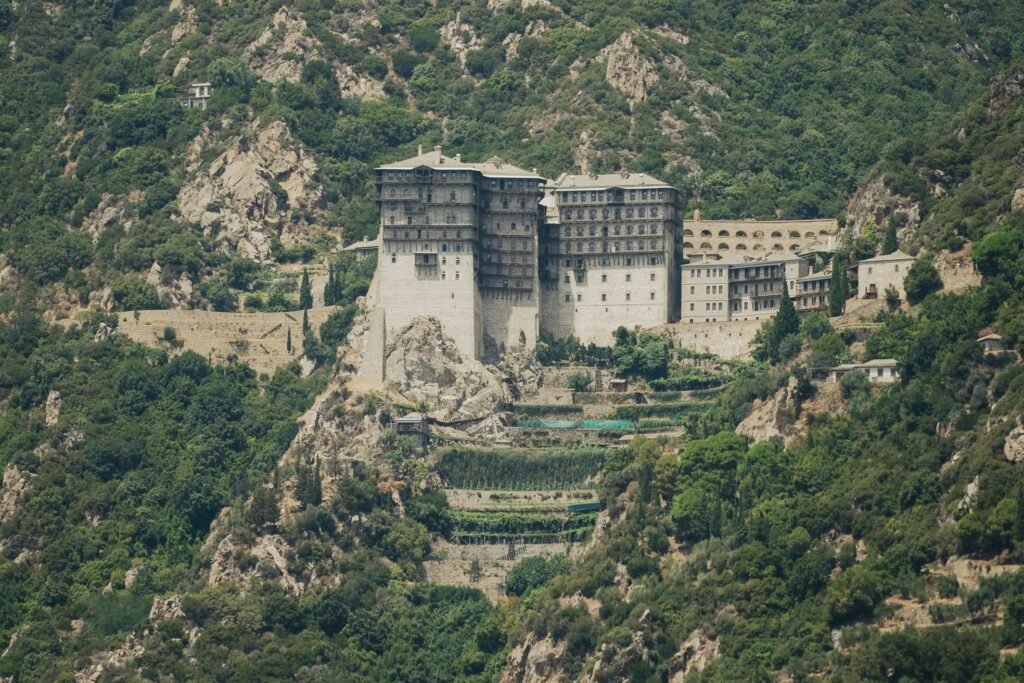 Simonos Petras monastery on the cliffs of Mount Athos, photographed from the sea during a private boat cruise from Ouranoupoli, Halkidiki