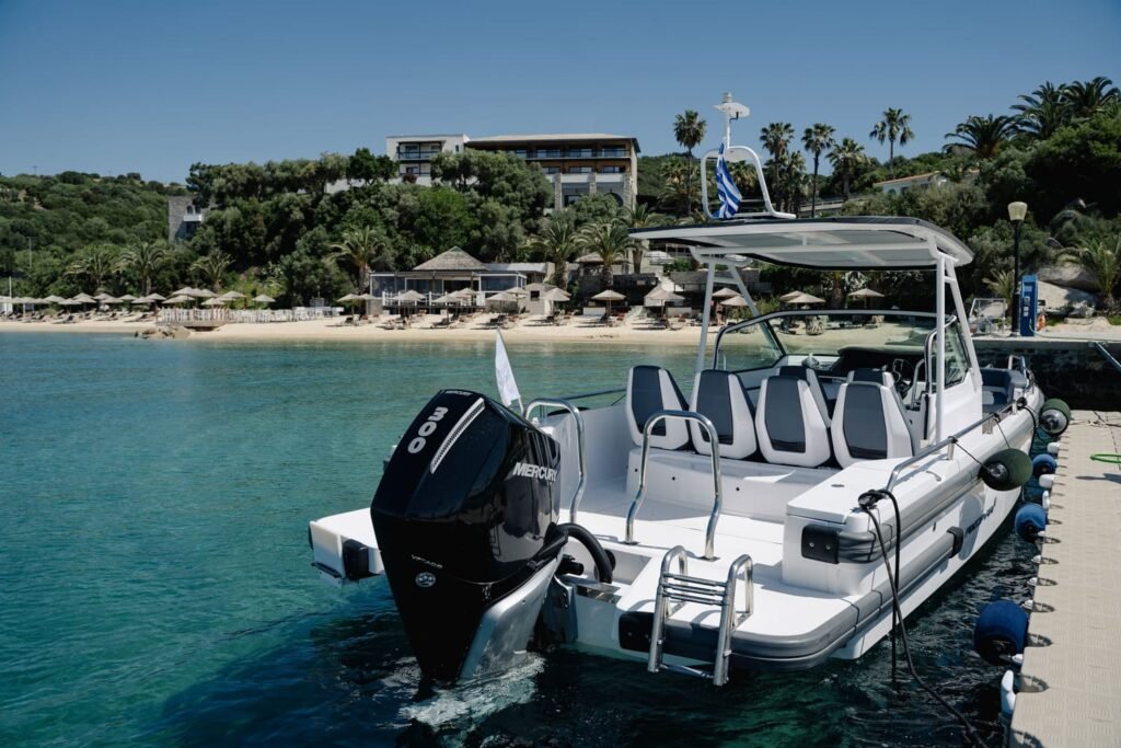 Axopar 28 private boat moored at the Eagles Resort beach jetty in Ouranoupoli, Halkidiki — departure point for private cruises