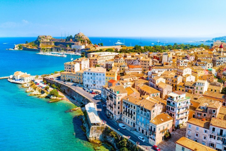 a body of water with buildings in the background